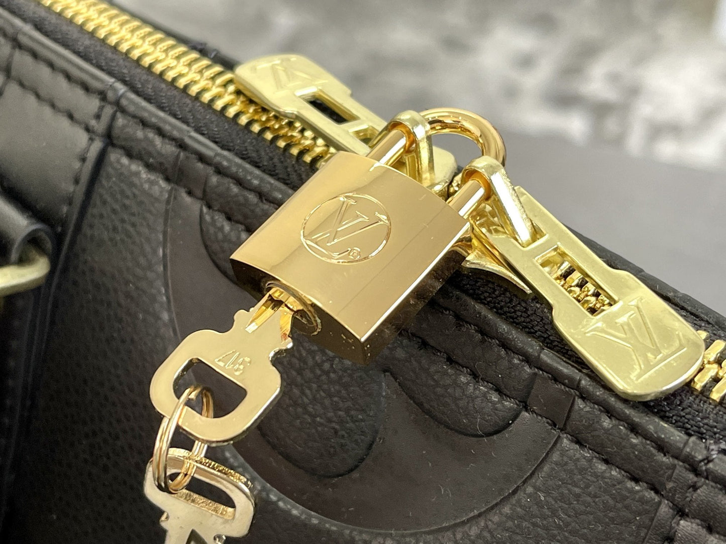 KEEPALL 45 BANDOULIERE MONOGRAM EMPREINTE GIANT