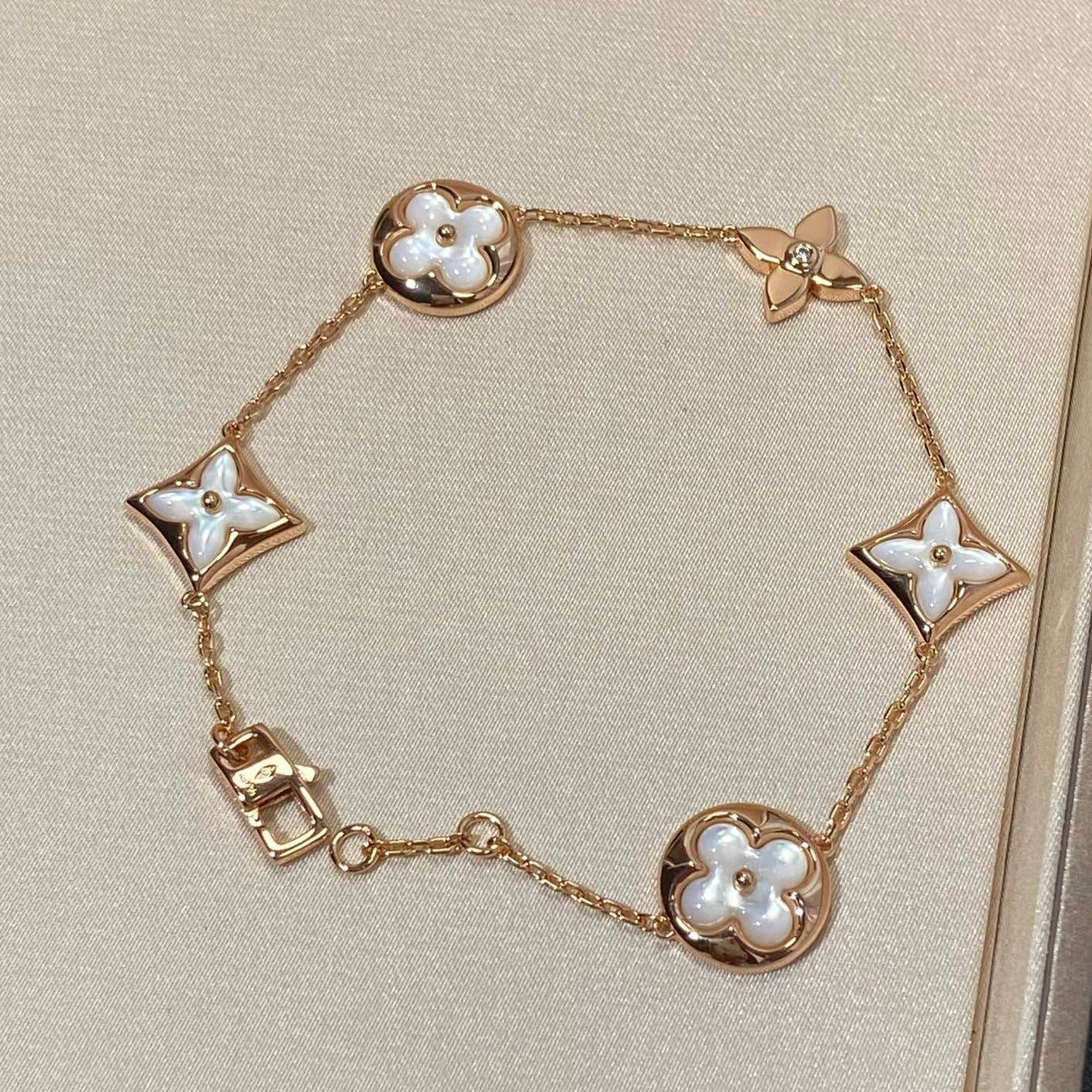 STAR AND SUN 5 MOTIF MOP PINK GOLD BRACELET