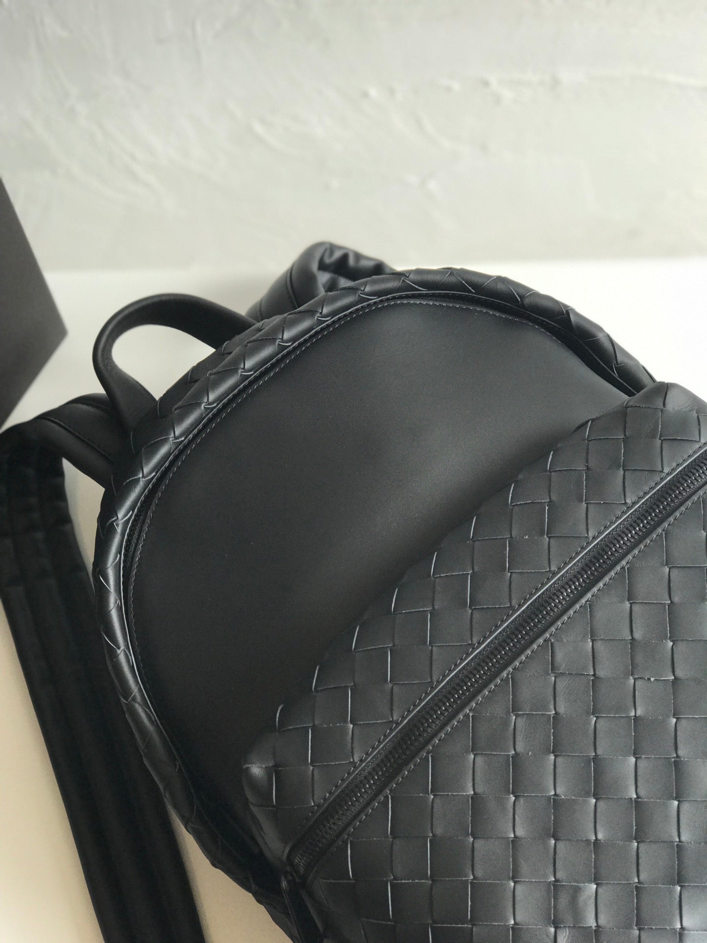 SMALL INTRECCIATO 41 BACKPACK IN BLACK CALFSKIN