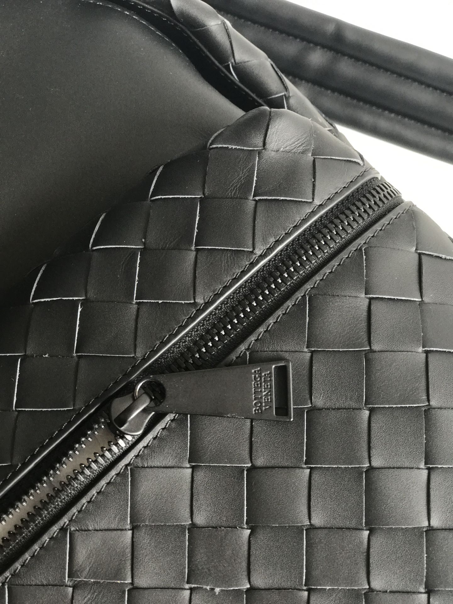 SMALL INTRECCIATO 41 BACKPACK IN BLACK CALFSKIN