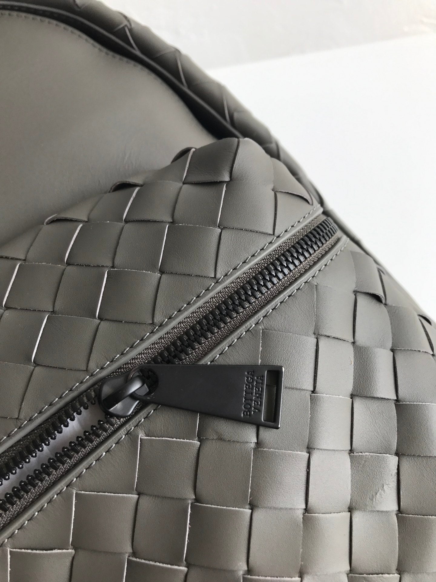 SMALL INTRECCIATO 41 BACKPACK IN CHARCOAL BLACK CALFSKIN