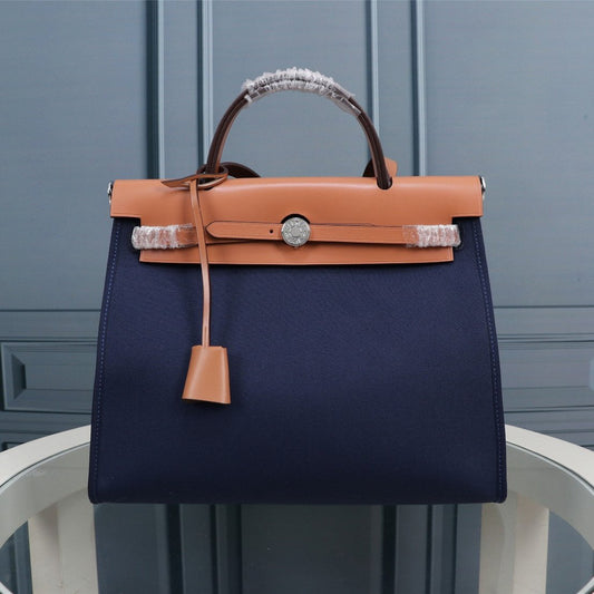 HM HERBAG ZIP 31 NAVY AND BRONZE CANVAS