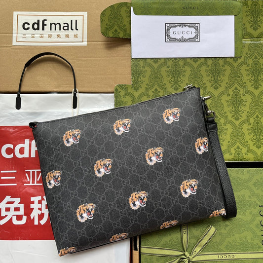 CLUTCH WITH TIGER PRINT 30 IN BLACK MONOGRAM CANVAS