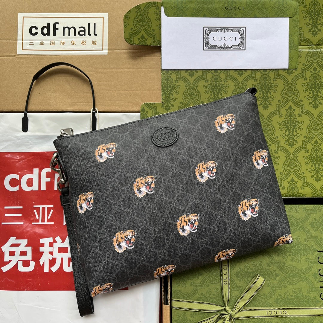 CLUTCH WITH TIGER PRINT 30 IN BLACK MONOGRAM CANVAS