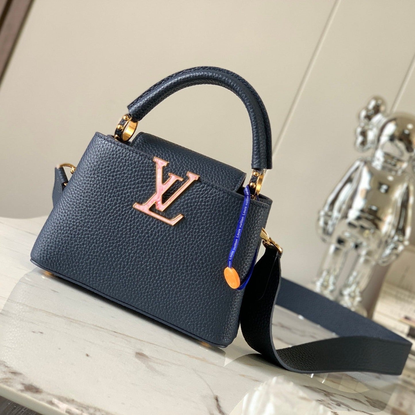 capucines mini 21 midnight blue taurillon leather gold hardware