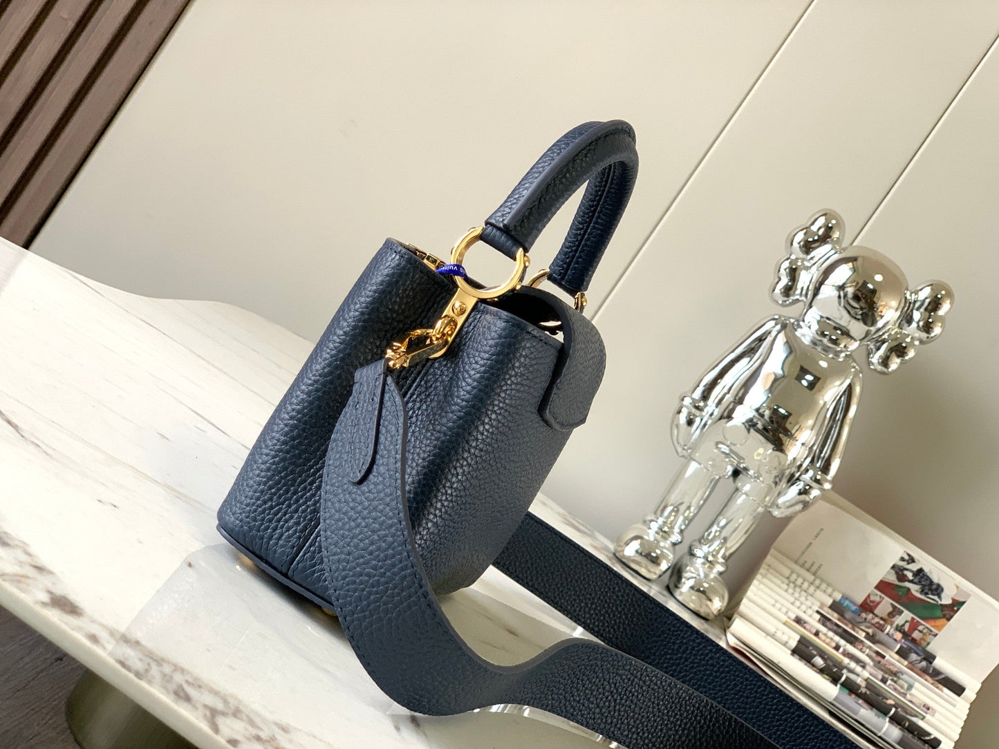 capucines mini 21 midnight blue taurillon leather gold hardware