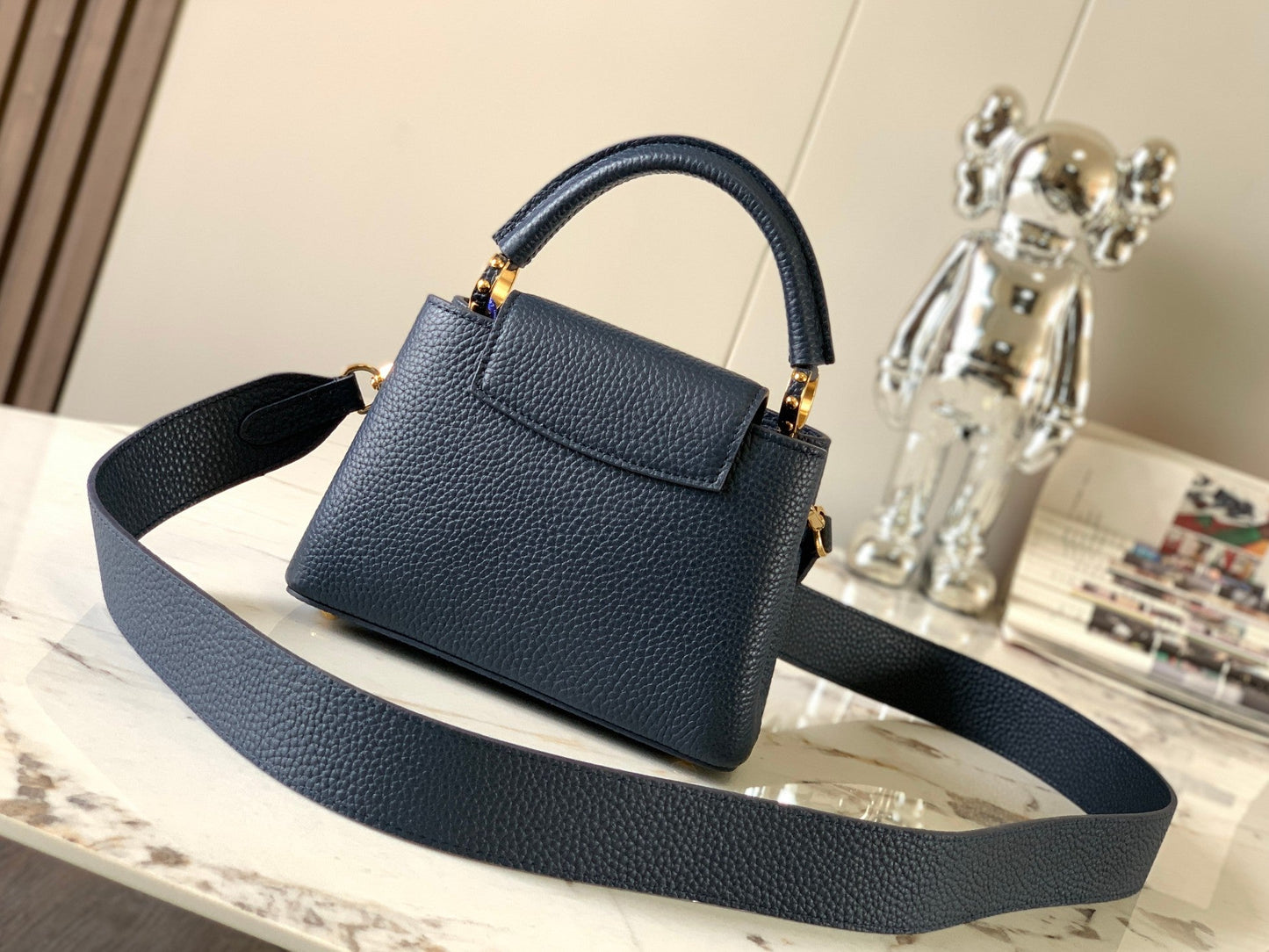 capucines mini 21 midnight blue taurillon leather gold hardware