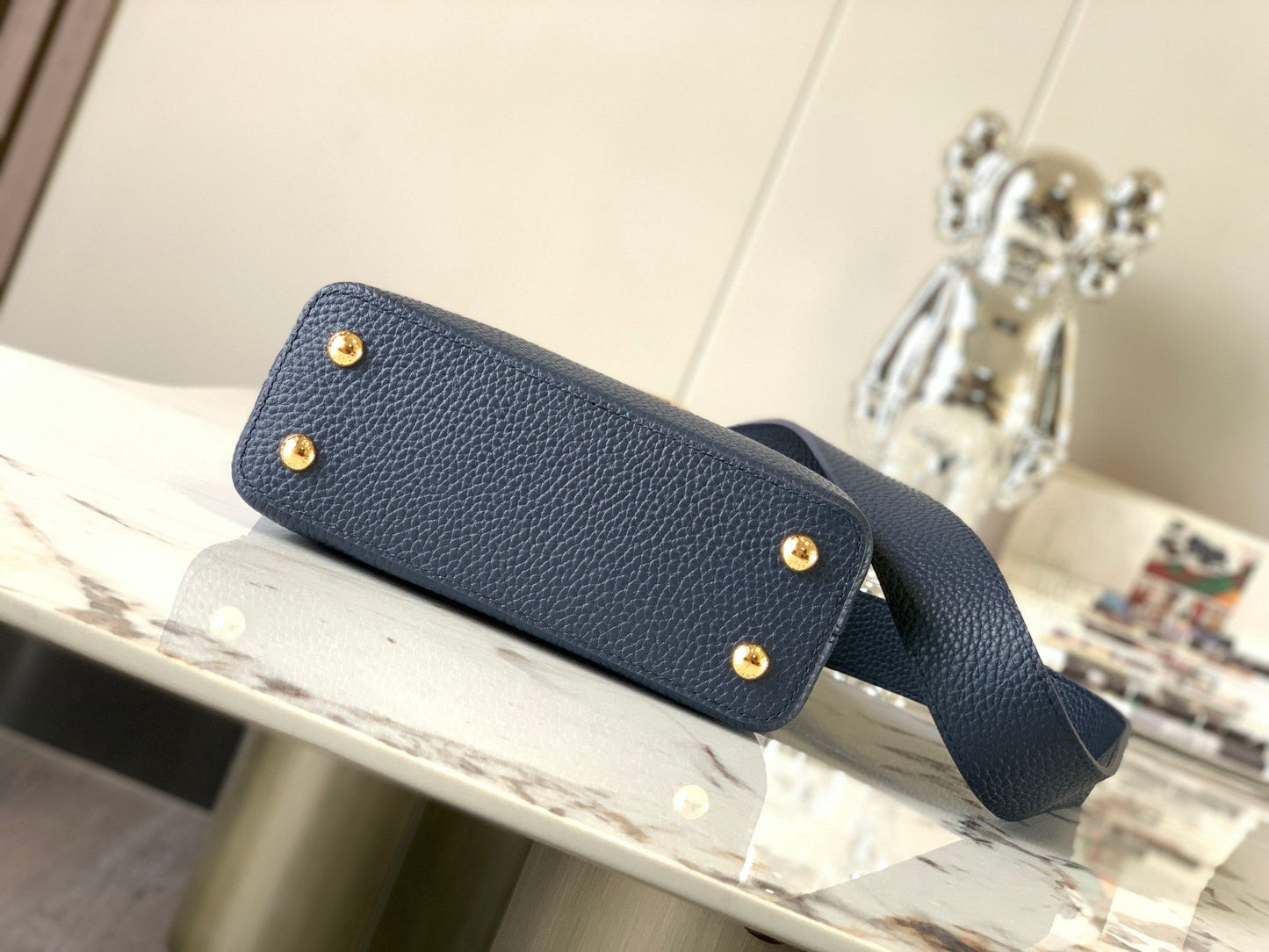 capucines mini 21 midnight blue taurillon leather gold hardware