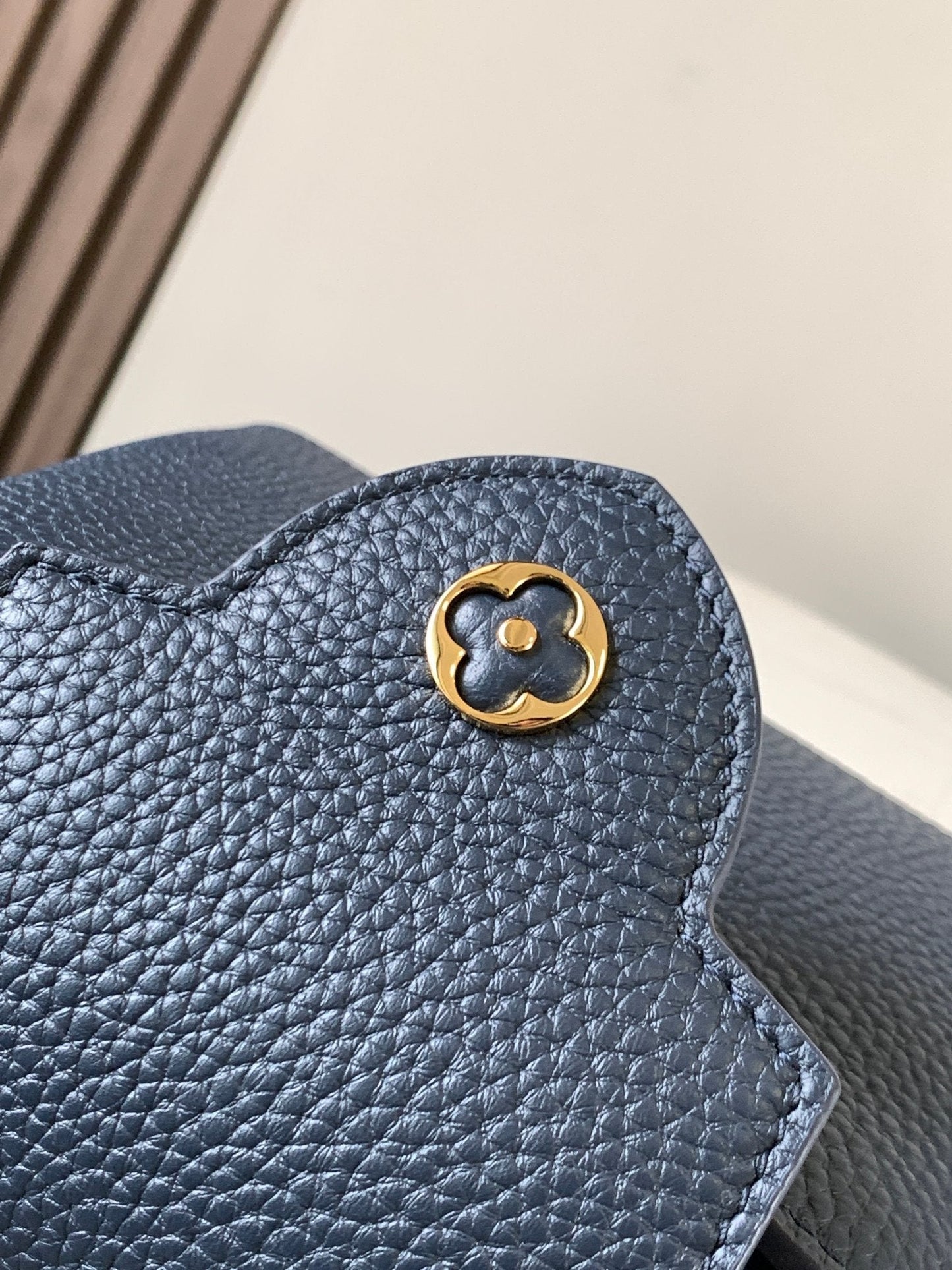 capucines mini 21 midnight blue taurillon leather gold hardware