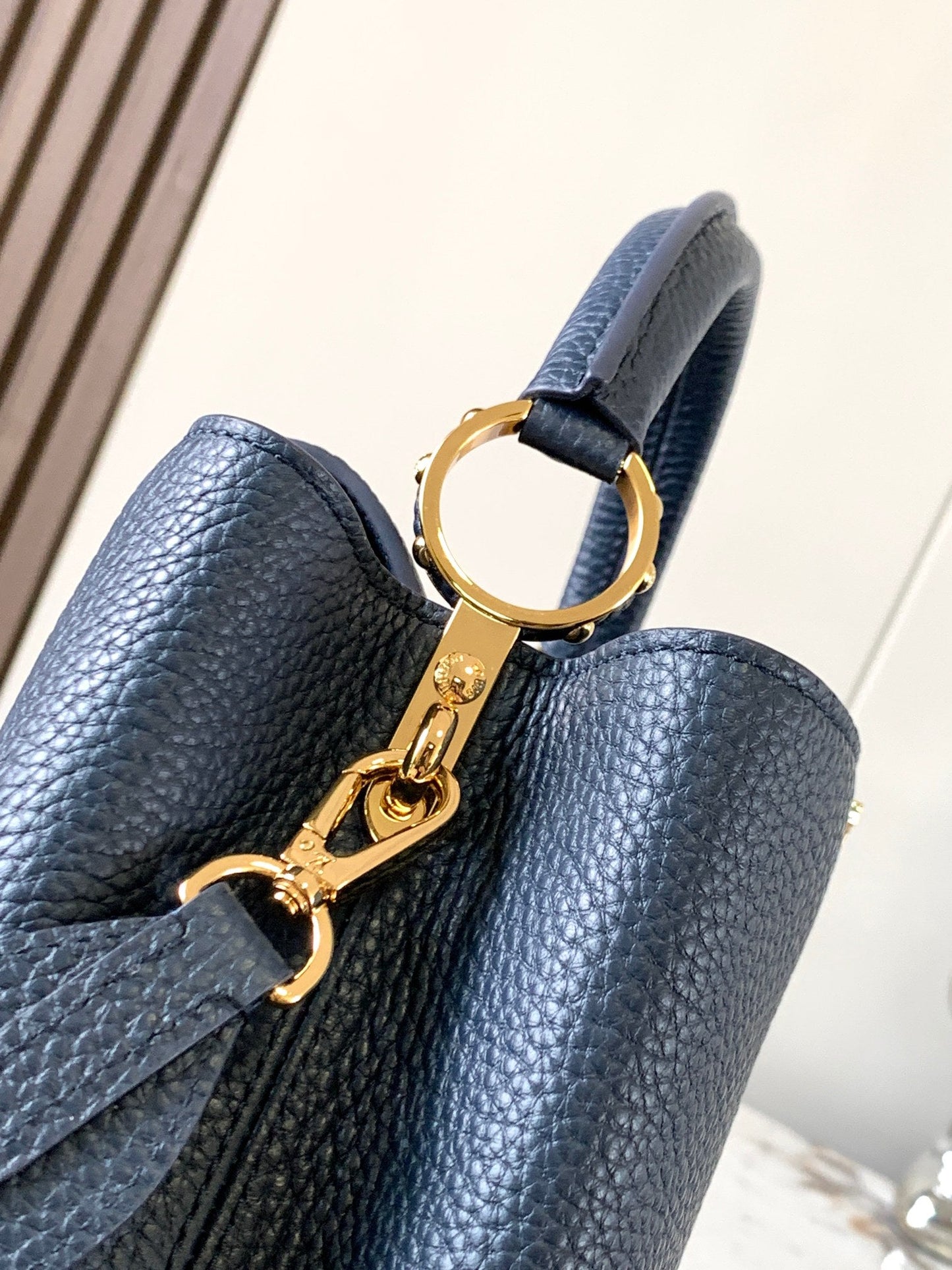 capucines bb 27 midnight blue taurillon leather gold hardware