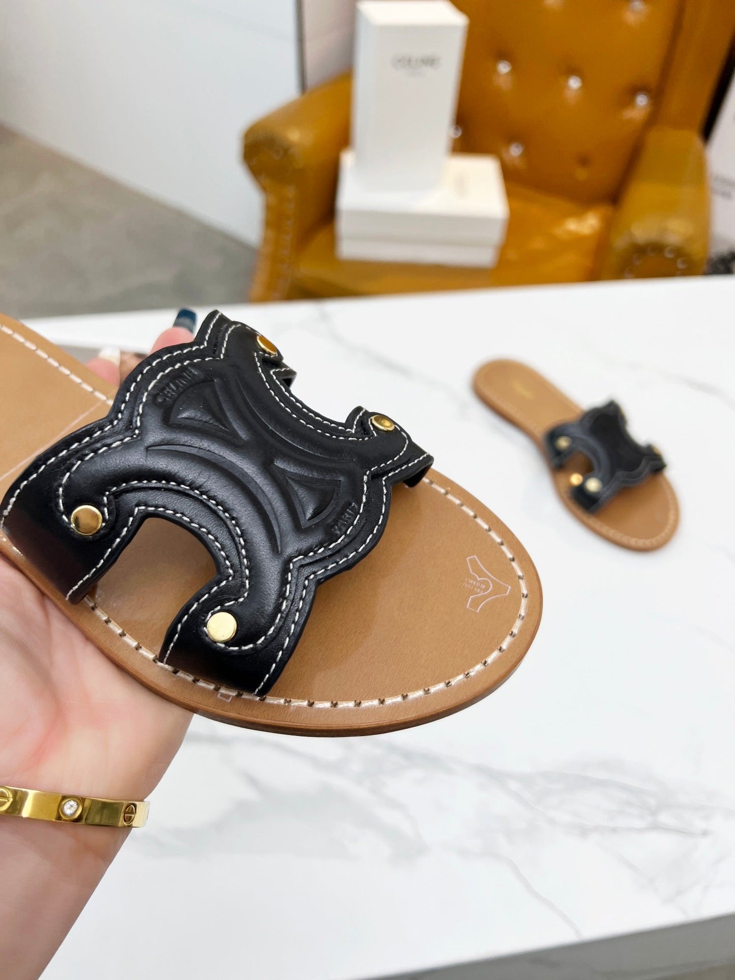 TRIOMPHE SLIDE IN BLACK CALFSKIN