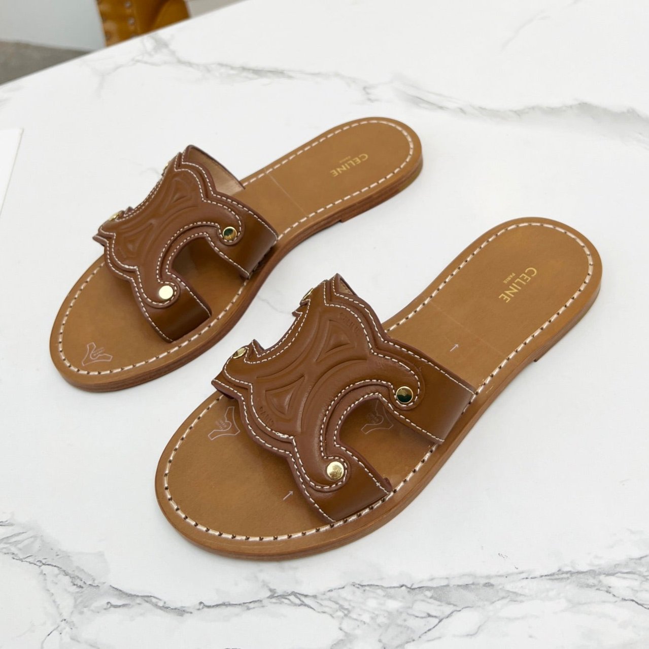 TRIOMPHE SLIDE IN BRONZE BROWN CALFSKIN