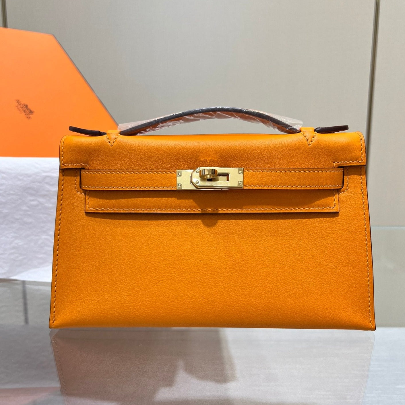 HM KELLY POCHETTE 22CM ORANGE SWIFT GOLD HARDWARE