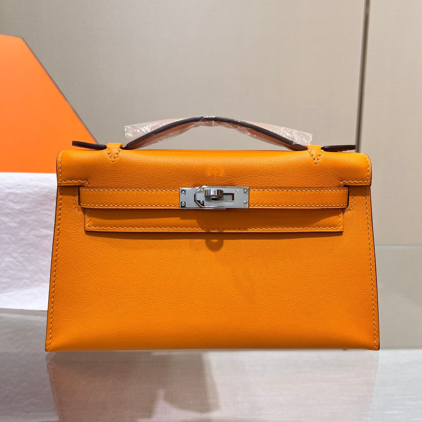 HM KELLY POCHETTE 22CM ORANGE SWIFT SILVER HARDWARE