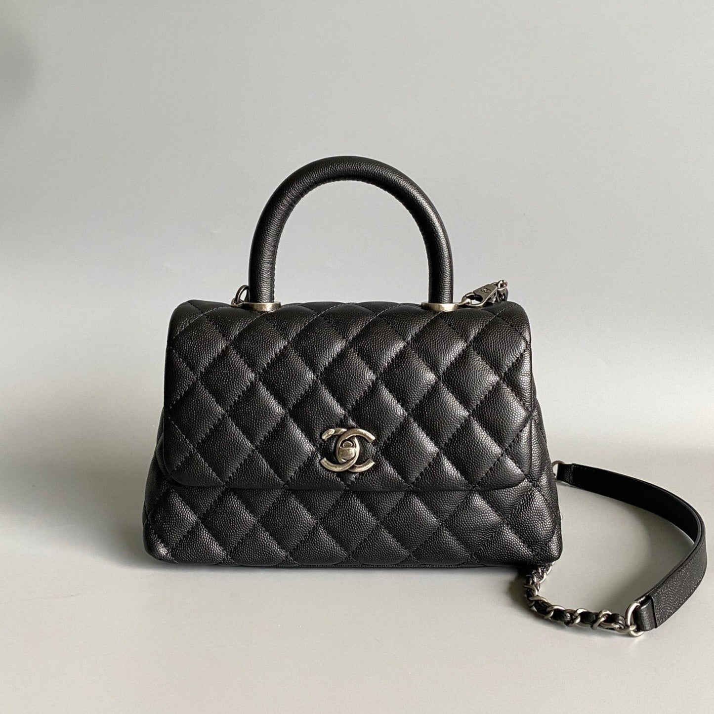 coco handle flap bag 23cm black quilted caviar black top handle