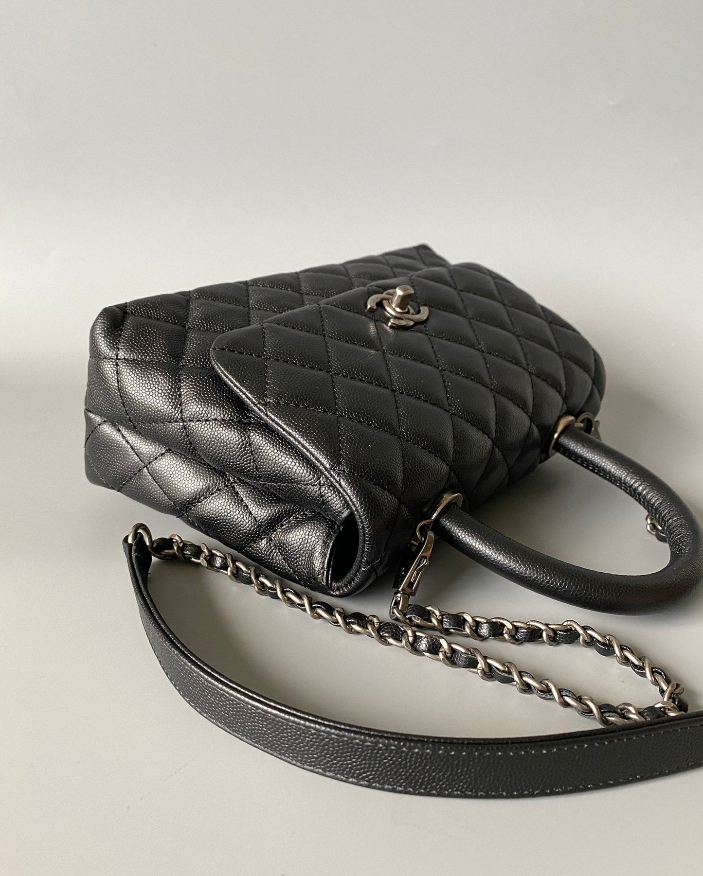 coco handle flap bag 23cm black quilted caviar black top handle