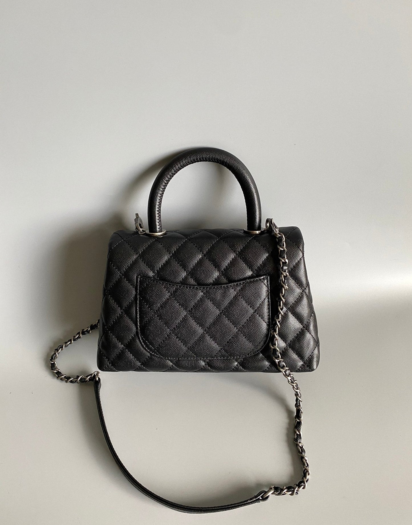 coco handle flap bag 23cm black quilted caviar black top handle