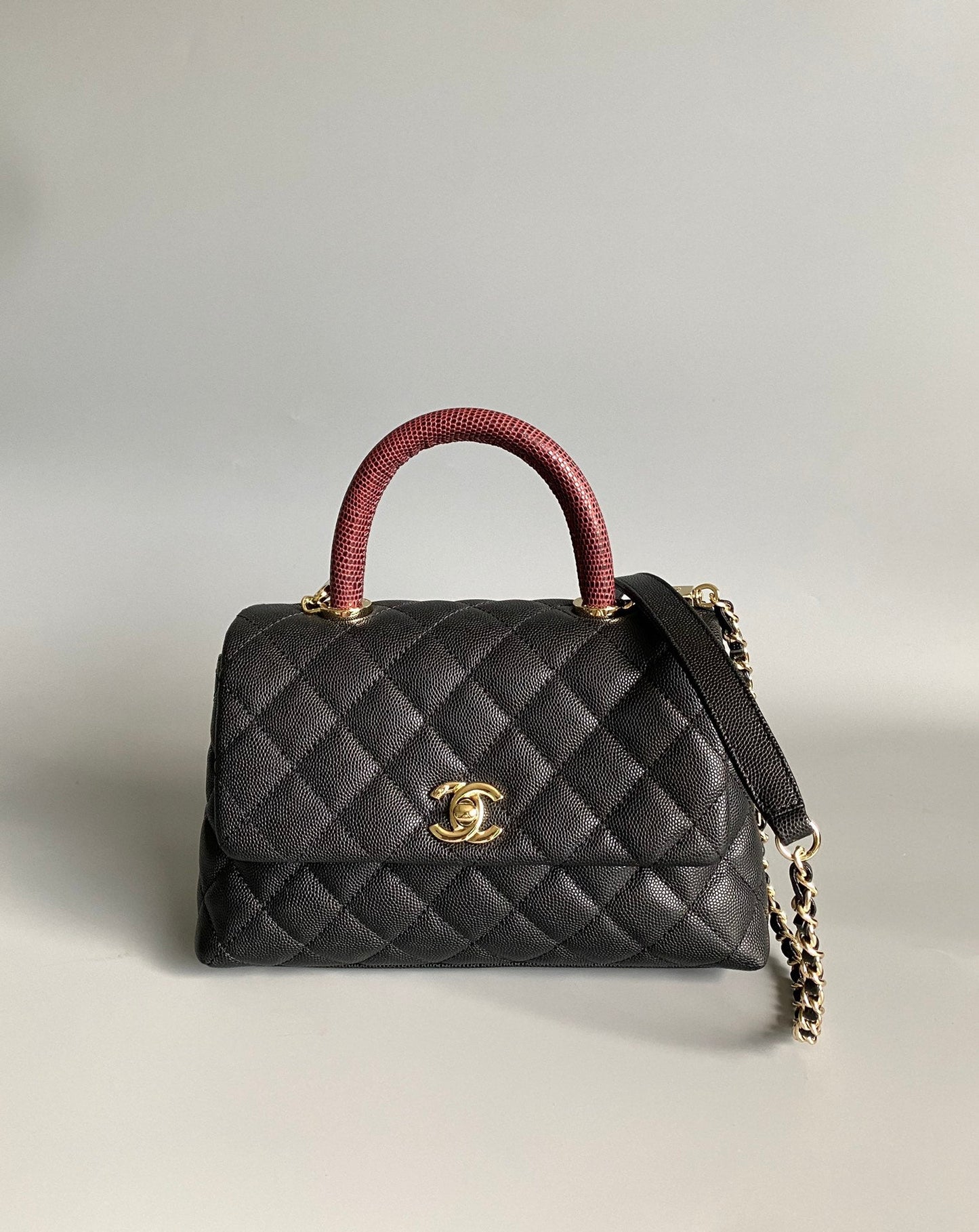 coco handle flap bag 23cm black quilted caviar with dark red top handle