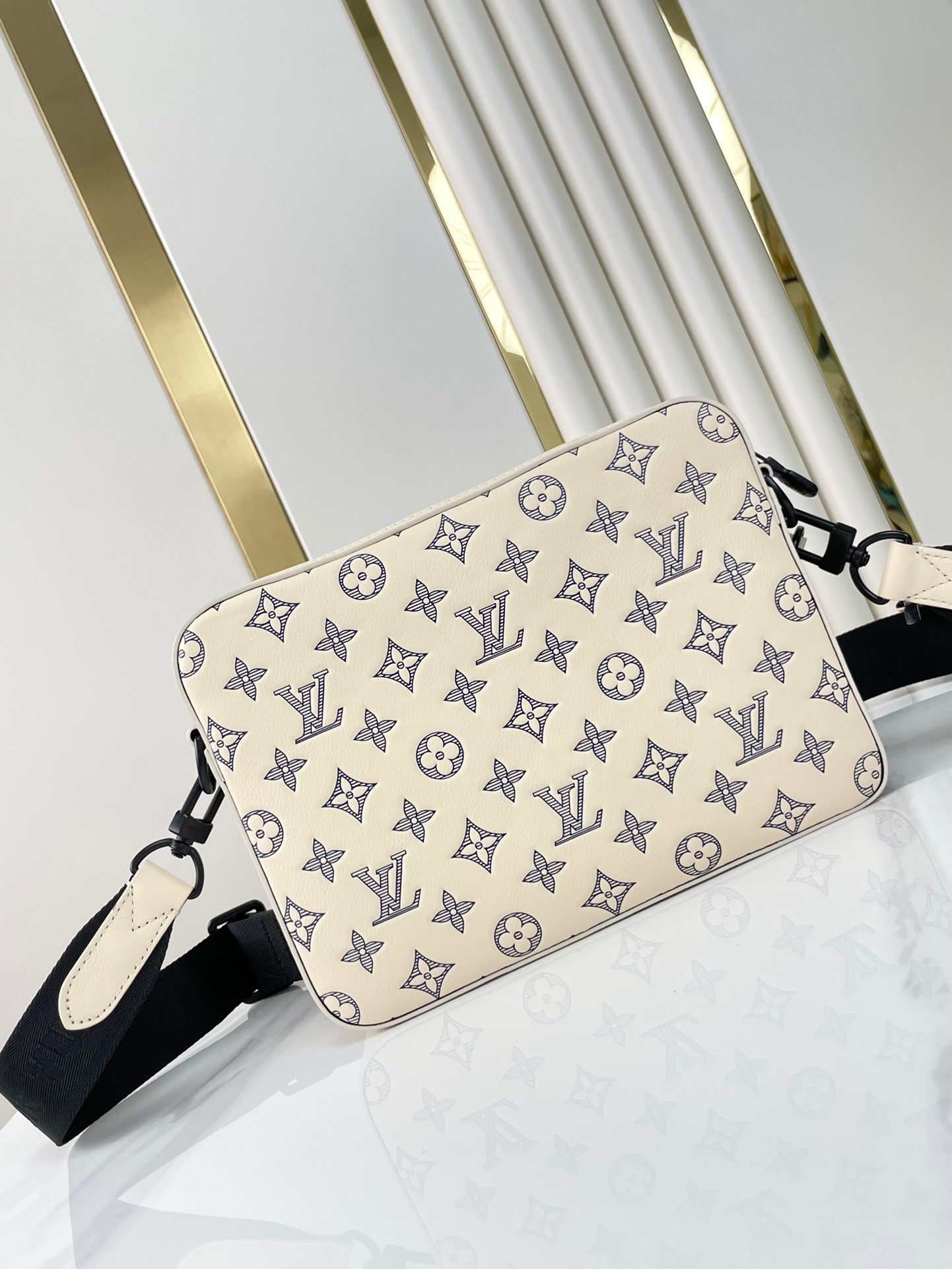 TRIO MESSENGER 25 IN CREAM BLUE MONOGRAM SHADOW CALFSKIN