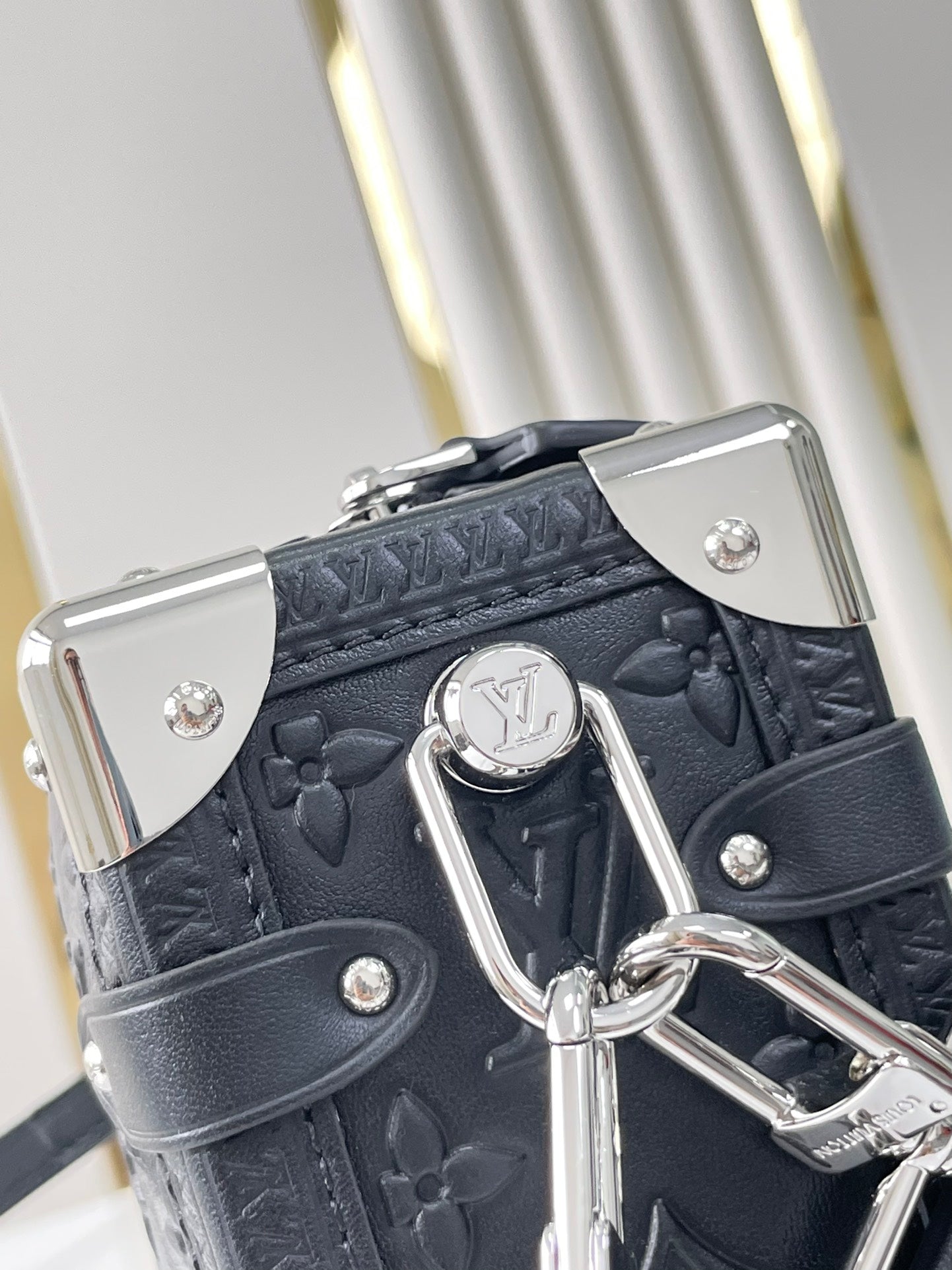 SIDE TRUNK 21 IN BLACK MONOGRAM EMBOSSED CALFSKIN SILVER HARDWARE