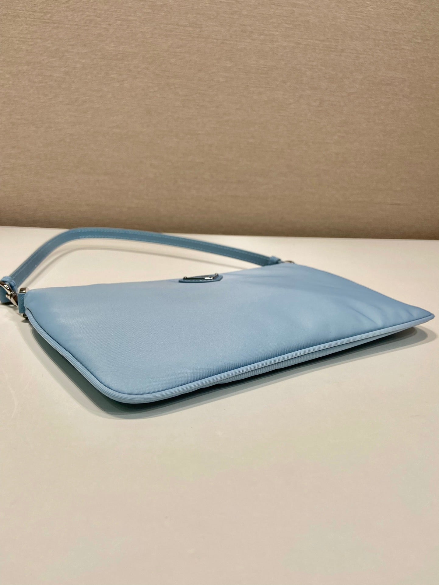 SHOULDER BAG 24 WITH TRIANGLE LOGO IN SKY BLUE RE-NYLON FABRIC