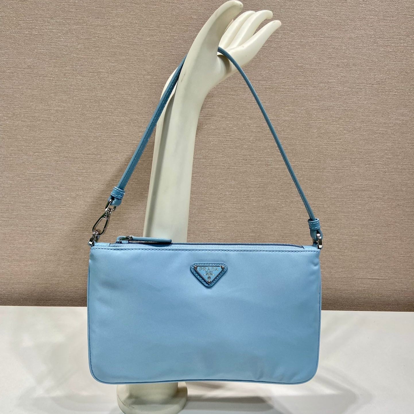 SHOULDER BAG 24 WITH TRIANGLE LOGO IN SKY BLUE RE-NYLON FABRIC