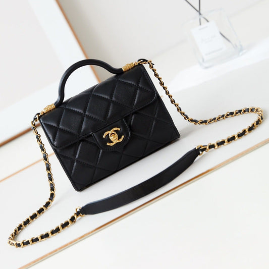 24a flap bag with top handle 18cm black lambskin gold hardware