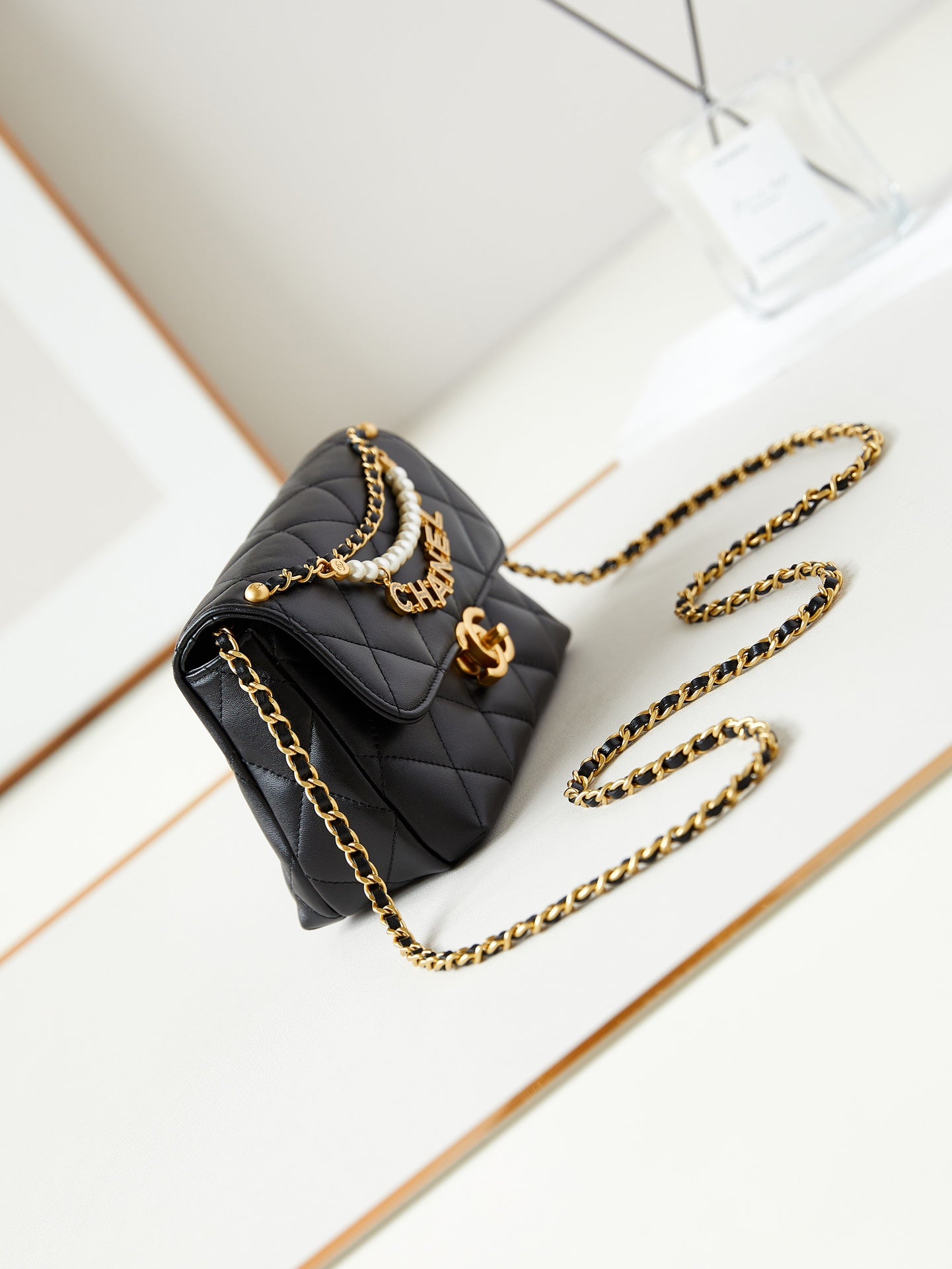 24a mini flap bag 20cm black lambskin pearl and gold hardware