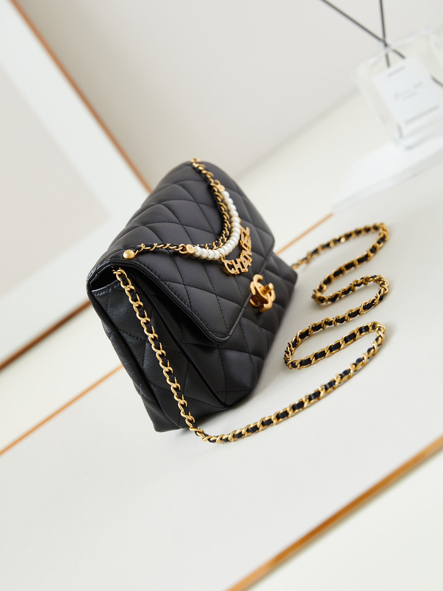 24a small flap bag 23cm black lambskin pearl and gold hardware