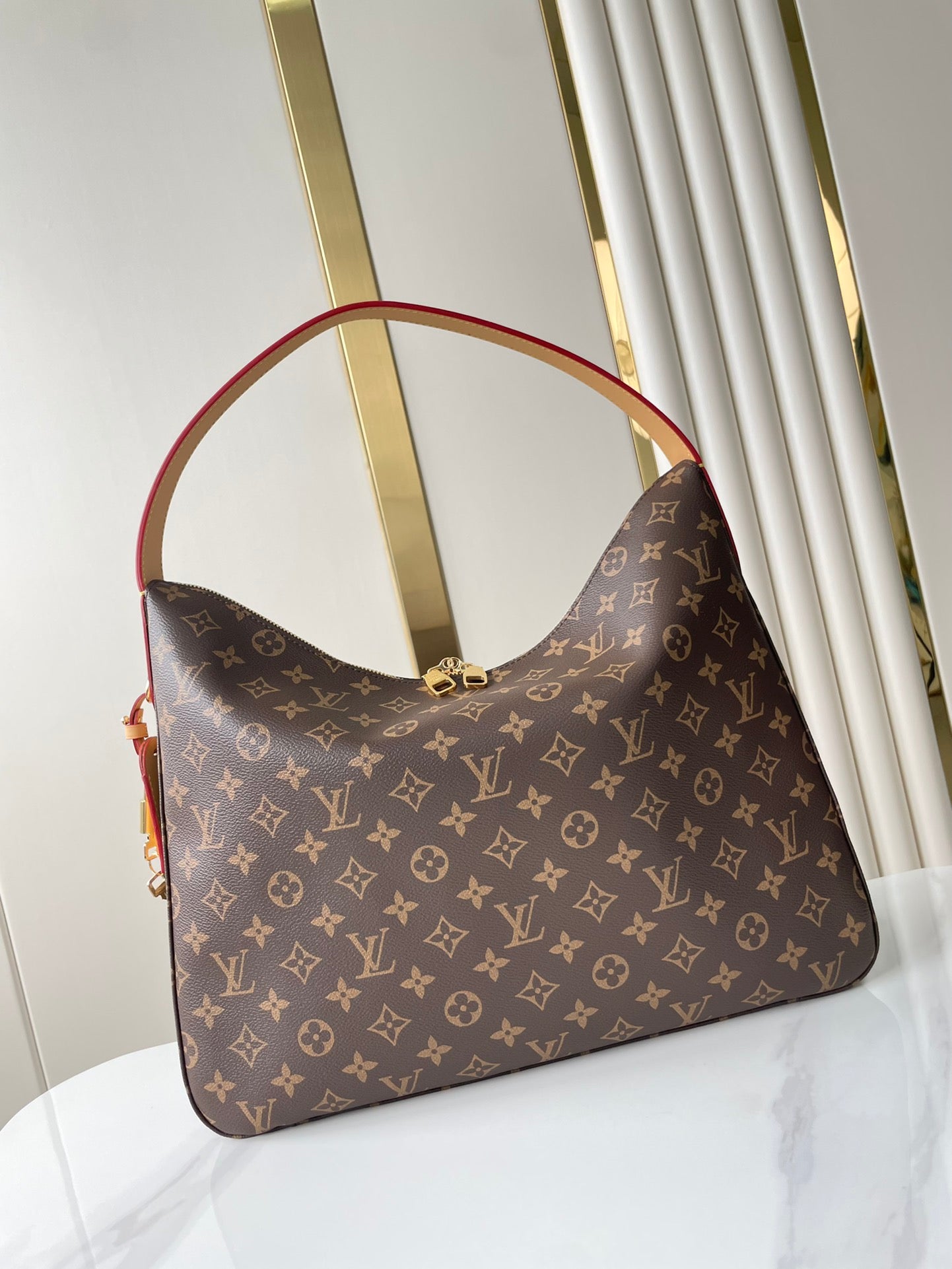 SLOUCHY MM 40 IN BROWN MONOGRAM CANVAS