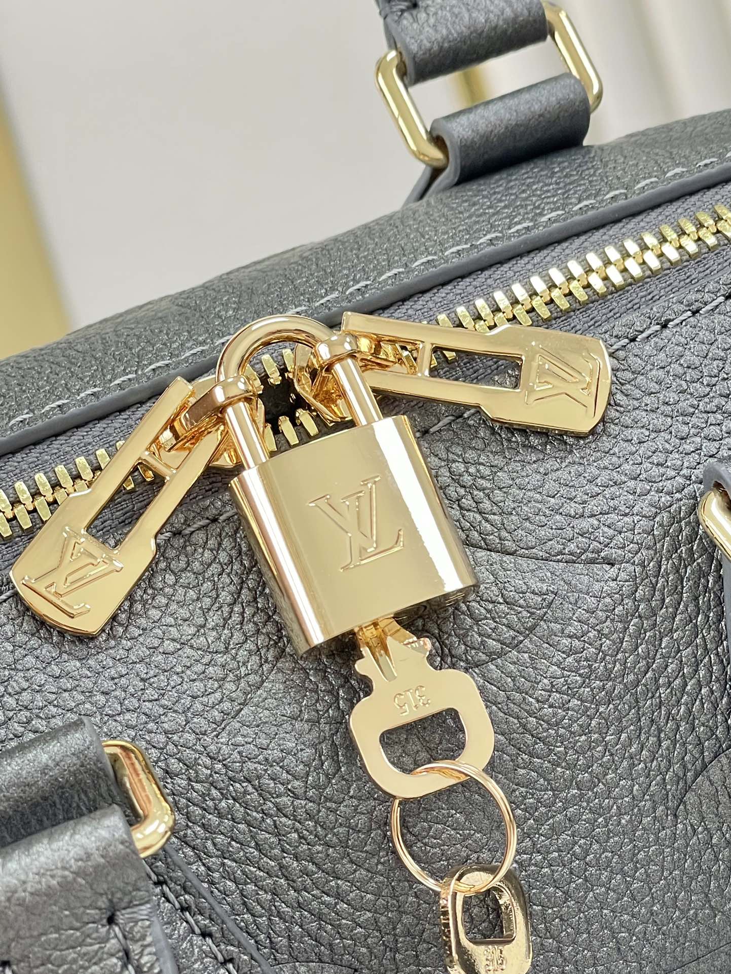 SPEEDY BANDOULIÈRE 20 IN GUN METAL MONOGRAM EMPREINTE GOLD HARDWARE