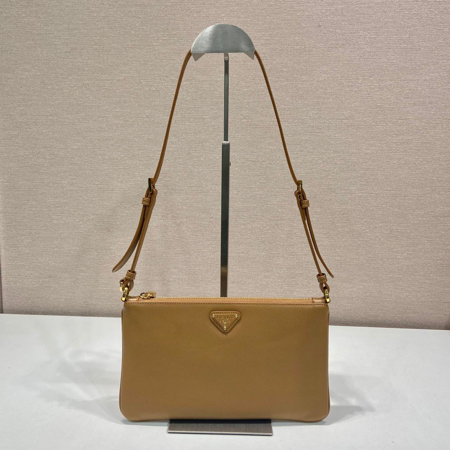 TRIANGLE LOGO SHOULDER BAG 24 IN PEANUT BROWN SMOOTH CALFSKIN