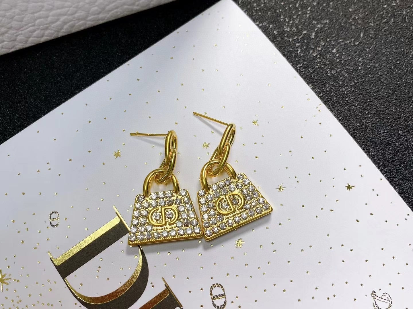 CD BAG GOLD DIAMOND EARRINGS