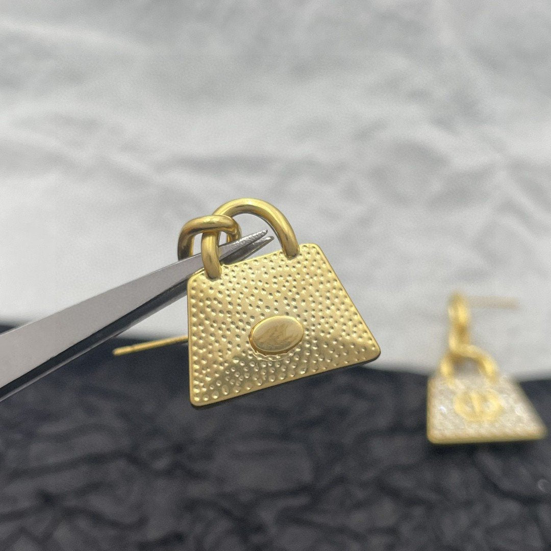 CD BAG GOLD DIAMOND EARRINGS