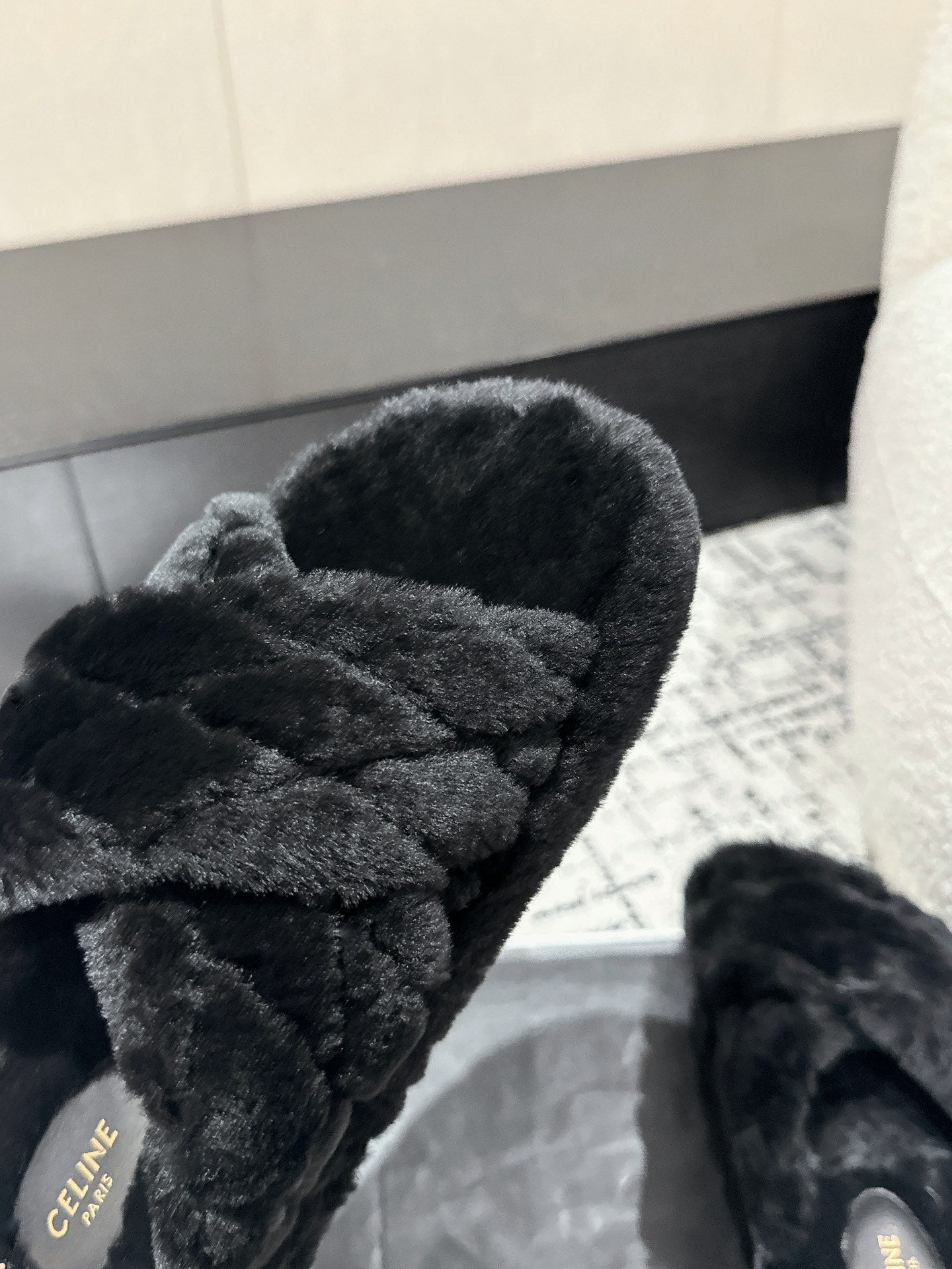 CROSS STRAP SLIPPER IN BLACK SHEARLING