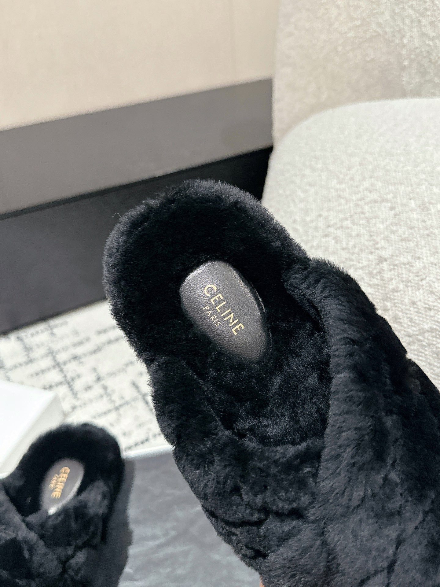 CROSS STRAP SLIPPER IN BLACK SHEARLING