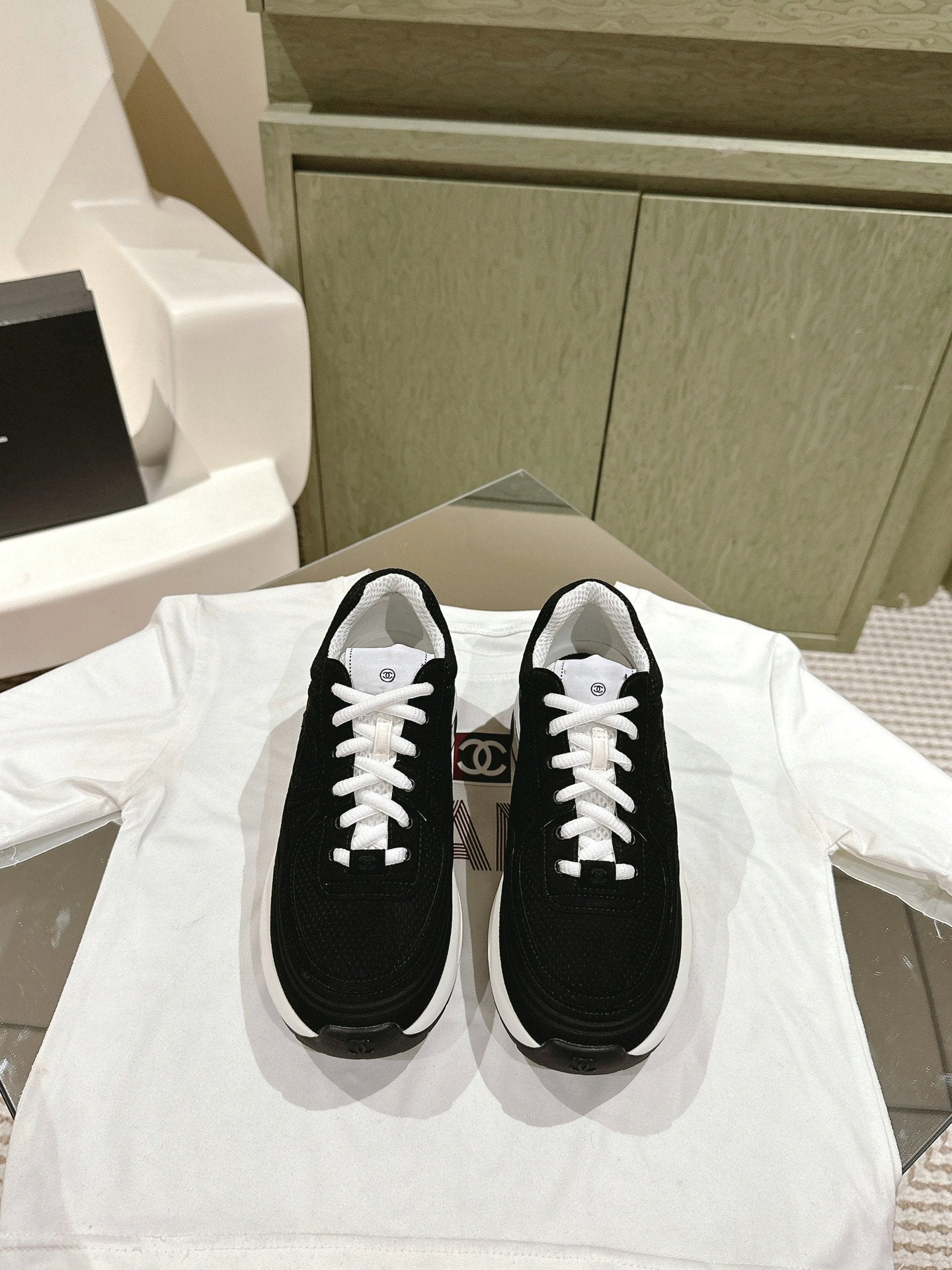 cc trainer black white fabric