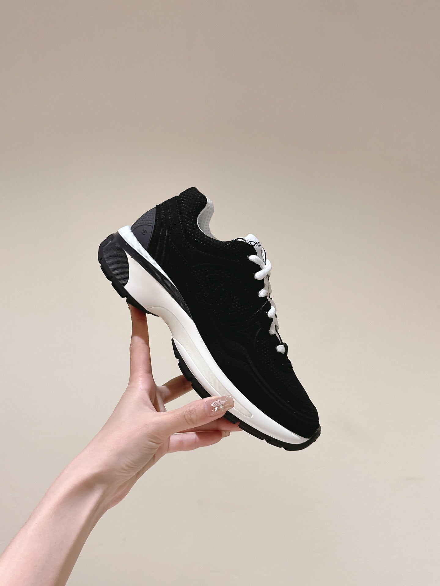 cc trainer black white fabric