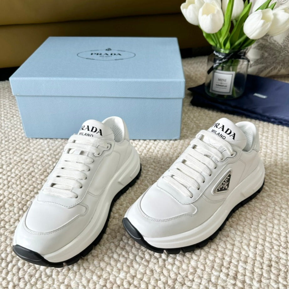 PRA THICK SOLE SNEAKER WHITE AND BLACK LOGO CALFSKIN