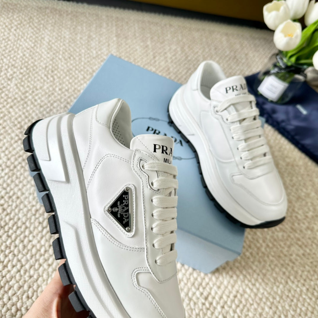 PRA THICK SOLE SNEAKER WHITE AND BLACK LOGO CALFSKIN