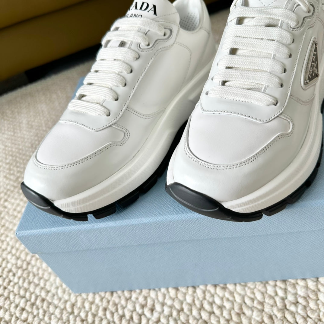 PRA THICK SOLE SNEAKER WHITE AND BLACK LOGO CALFSKIN