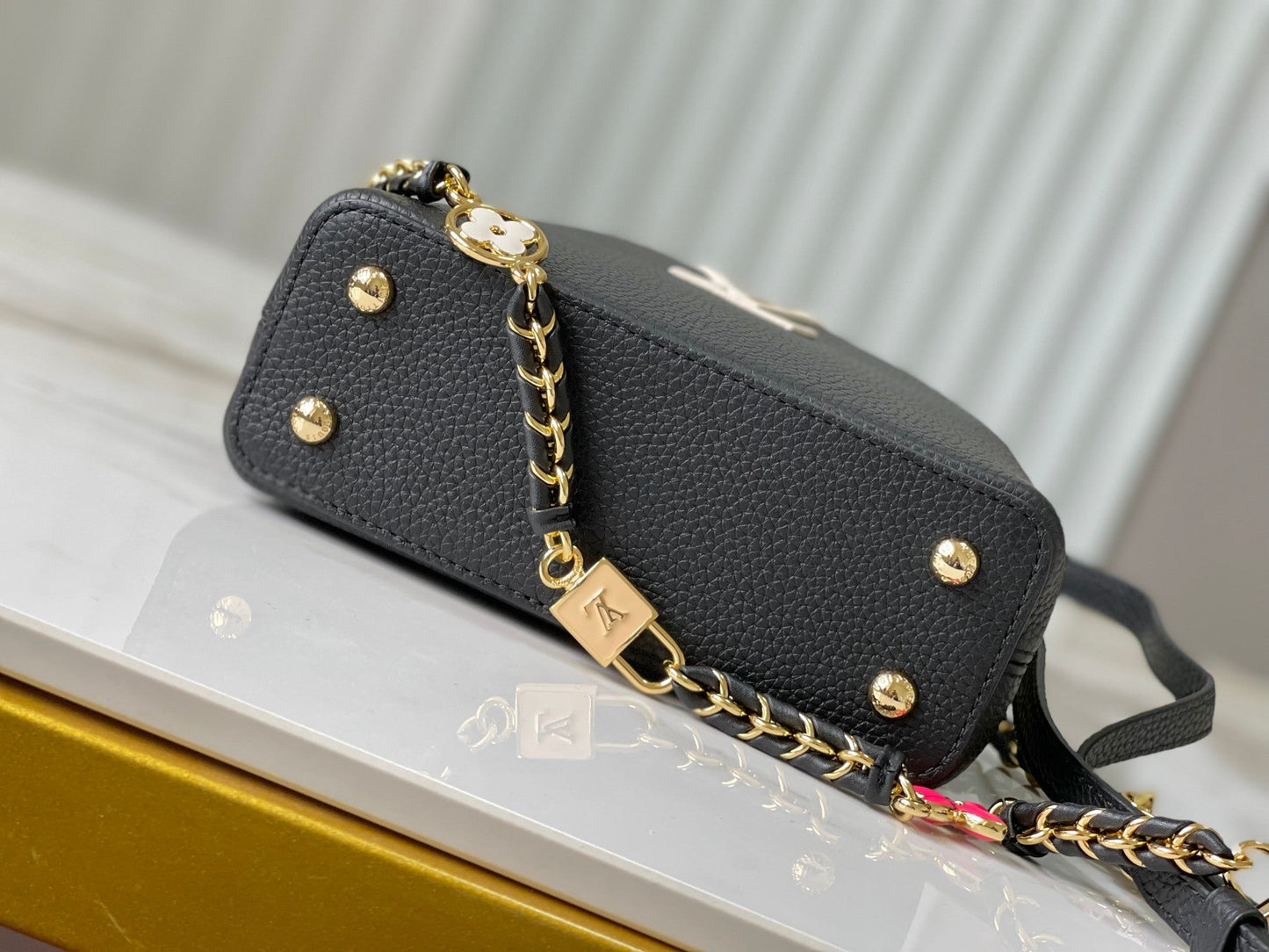 capucines mini 21 black taurillon leather gold hardware