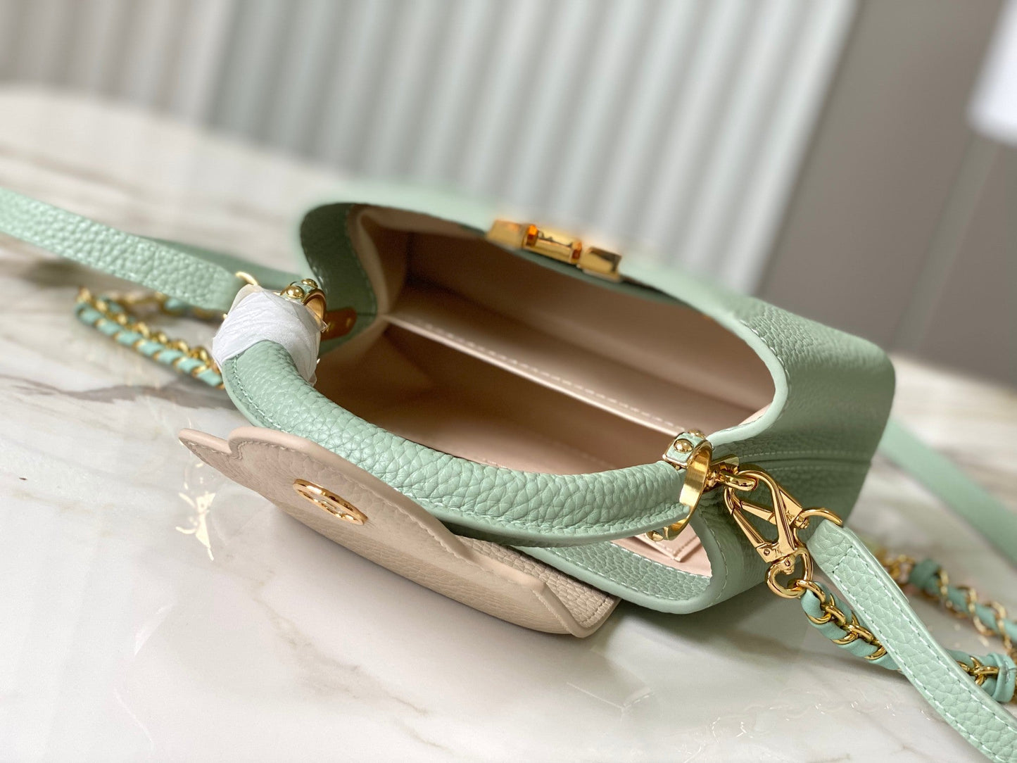 capucines mini 21 green beige taurillon leather gold hardware