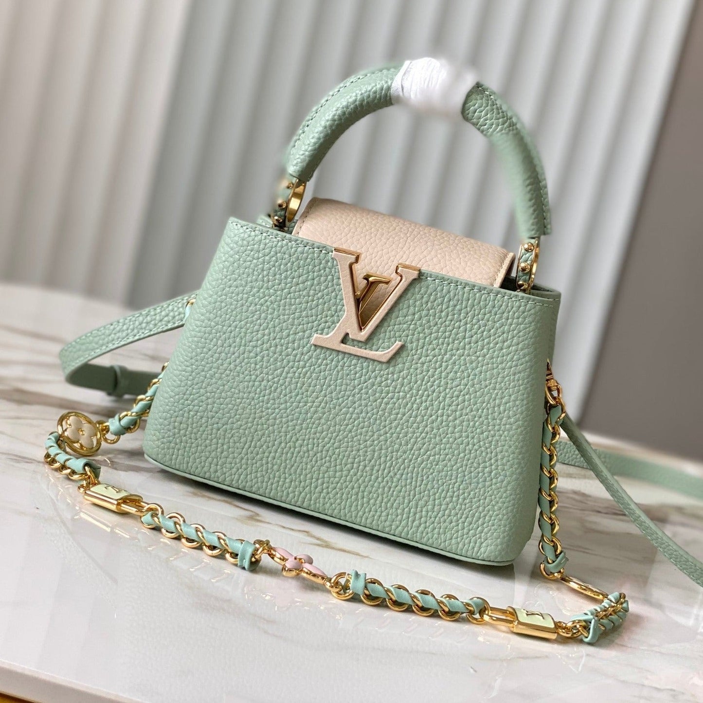 capucines mini 21 green beige taurillon leather gold hardware