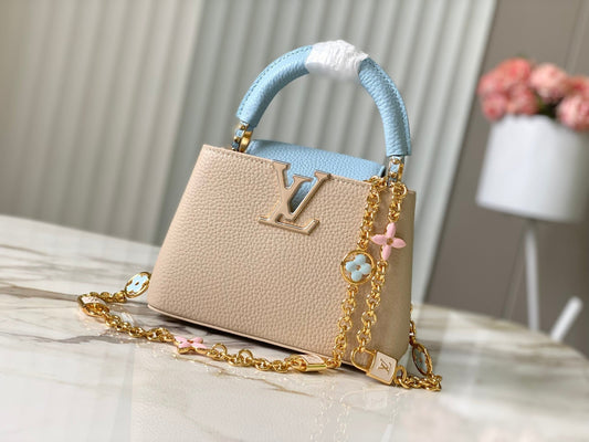 capucines mini 21 beige cloud blue taurillon leather gold hardware