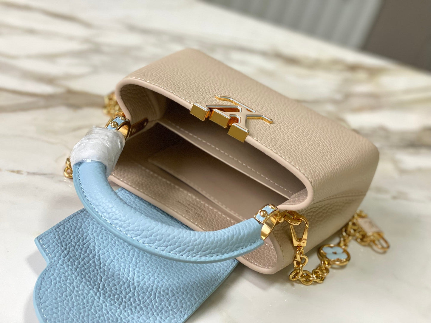 capucines mini 21 beige cloud blue taurillon leather gold hardware