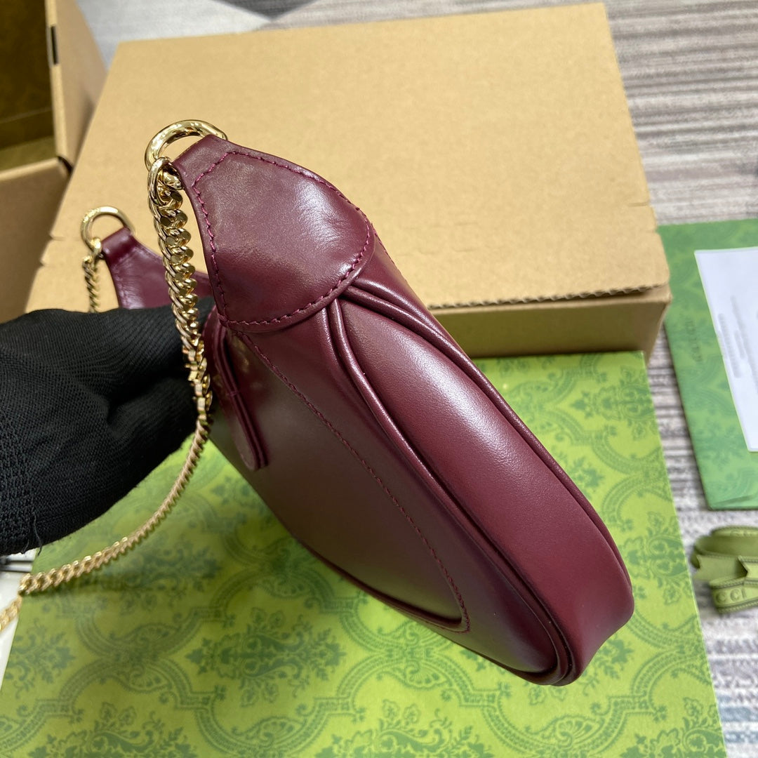 JACKIE NOTTE MINI BAG 19 IN BURGUNDY RED CALFSKIN GOLD HARDWARE