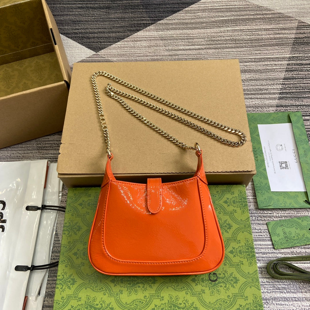 JACKIE NOTTE MINI BAG 19 IN ORANGE CRACKED LACQUER CALFSKIN GOLD HARDWARE