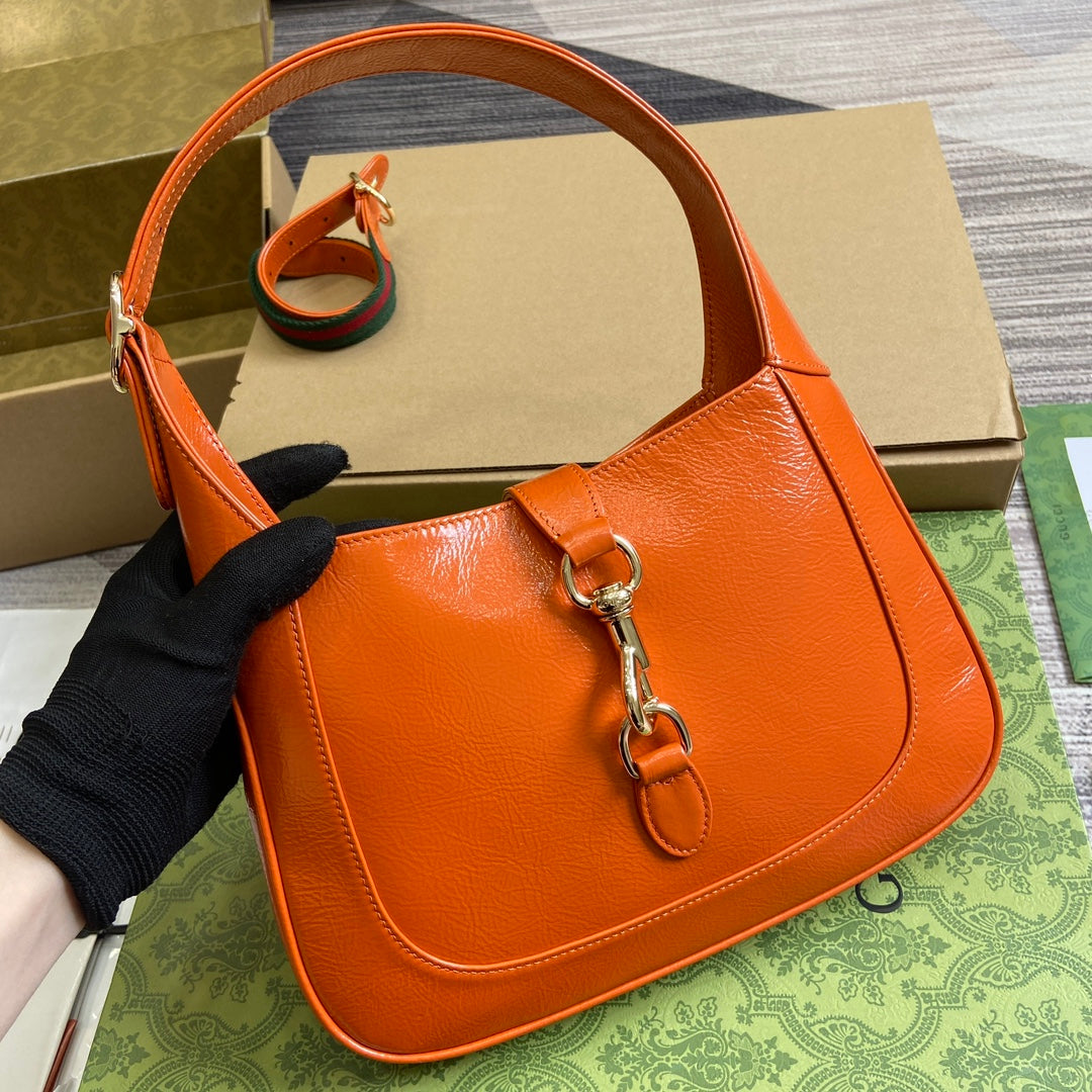 JACKIE SMALL SHOULDER BAG 27 IN ORANGE CRACKED LACQUER CALFSKIN GOLD HARDWARE