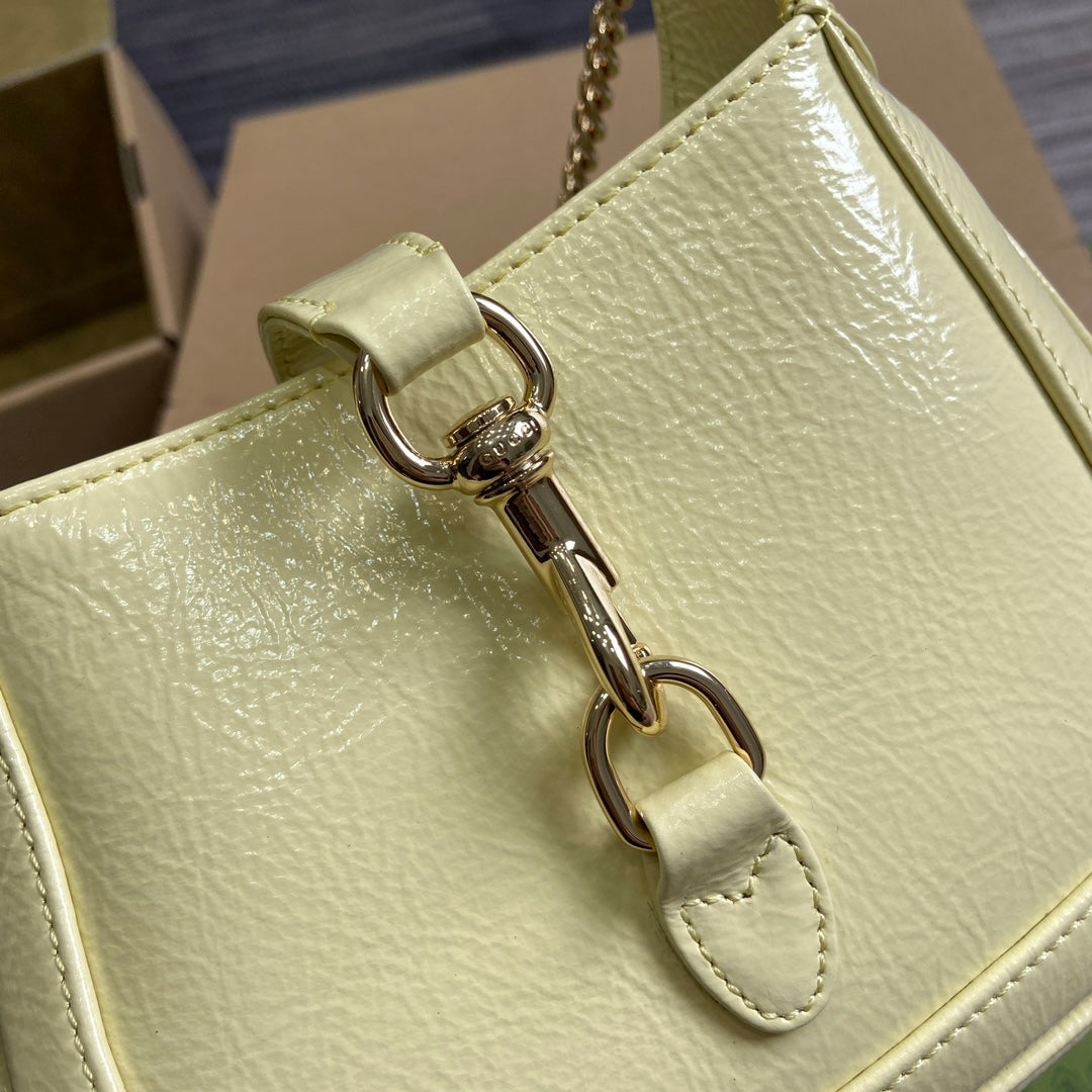 JACKIE NOTTE MINI BAG 19 IN LIGHT YELLOW CRACKED LACQUER CALFSKIN GOLD HARDWARE